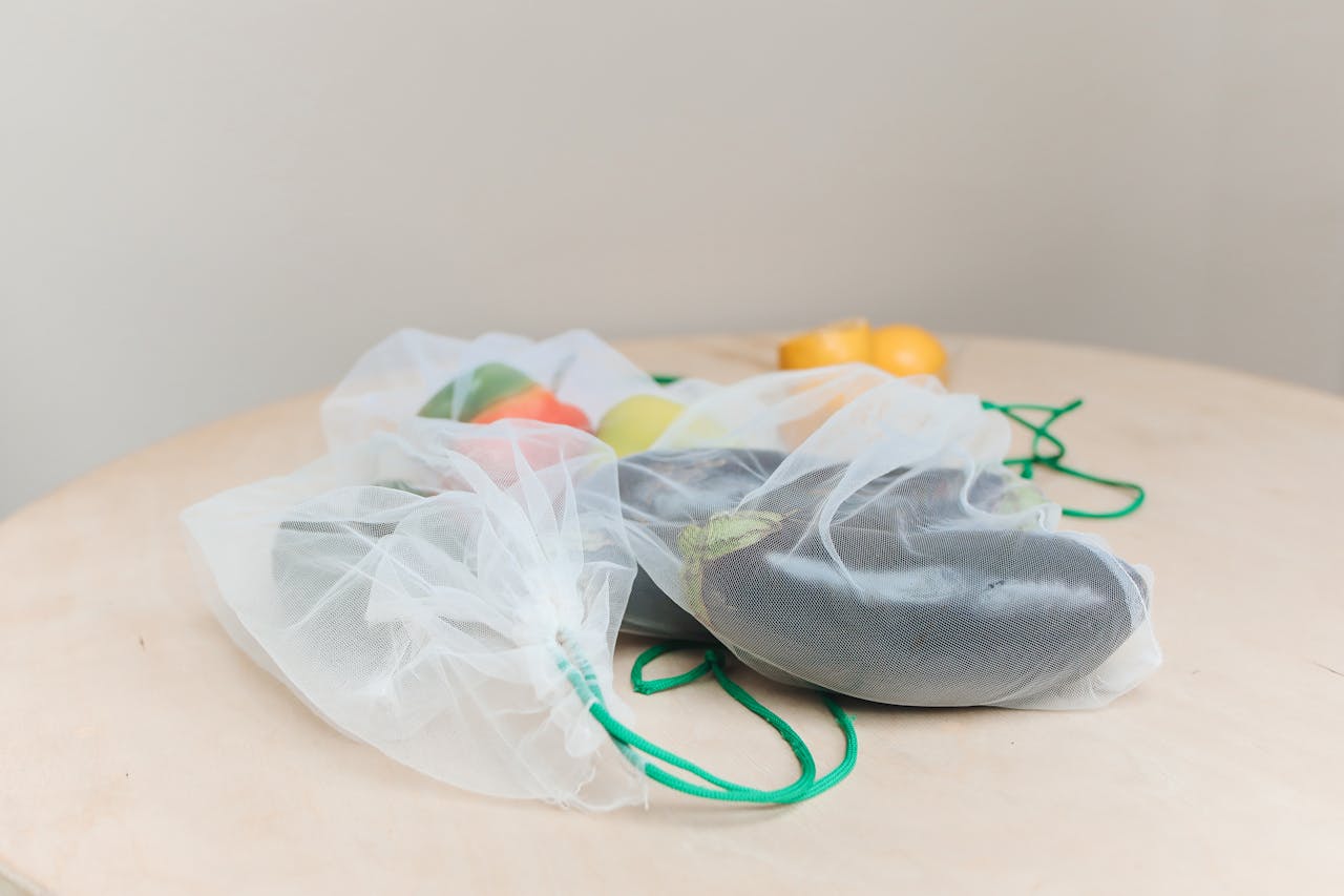 Eco-friendly produce in mesh bags promoting zero waste lifestyle.